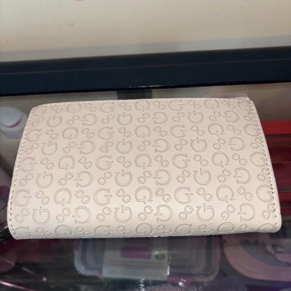 GUESS Cream Logo-Embossed Wristlet Wallet - Picture 9 of 10